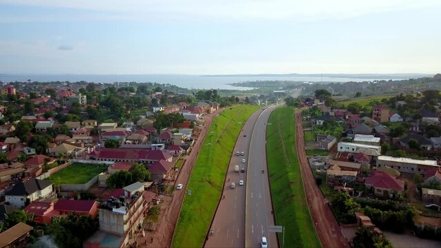 Scenic Drive On Kampala-Entebbe Expressway With View Of Lake Victoria In Uganda, East Africa. aerial shot