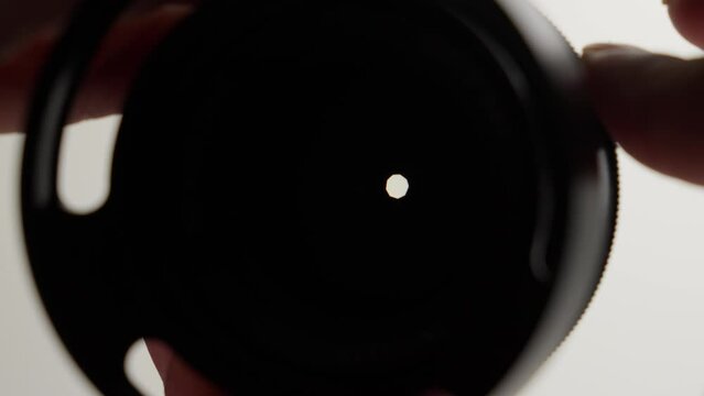 Camera equipment, lens aperture closing, f-stop adjustment, slow-mo