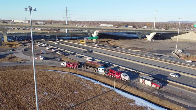 Aerial View Of Fallen cargo container recovery operation after rollover near exit ramp from the Champlain Bridge In Brossard, Montreal, Canada 