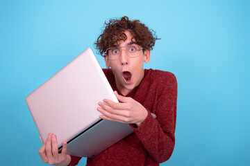 A funny guy who is trying to learn. Blue background.