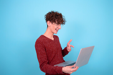 A funny guy who is trying to learn. Blue background.