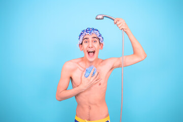 Funny guy takes a shower. Blue background.