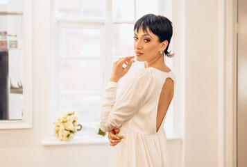 Beautiful bride with fashionable wedding hairstyle.  