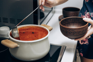 Red Ukrainian borscht on the table. Cooking the national first course