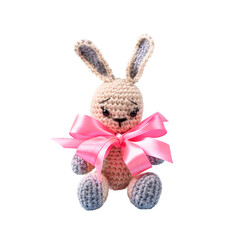 Knitted gray bunny with with pink satin ribbon bow isolated on white background.