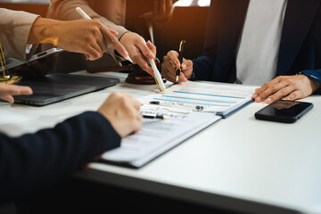 Teamwork of business lawyer meeting working hard about legal legislation in courtroom to help their...