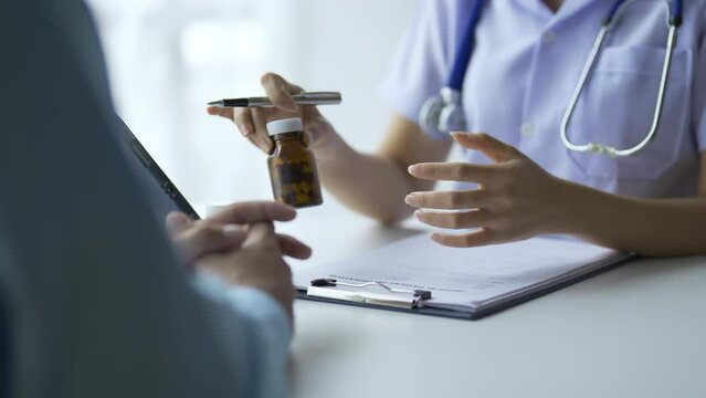 Doctor who records a patient's detailed information or medication history is evaluating medications and vaccines for the intended treatment. or if there are any side effects.