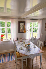 Interior of an old cottage with table settings for coffee