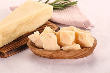 Chopped Italian hard parmesan cheese