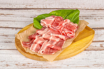 Sliced pork bacon in the bowl