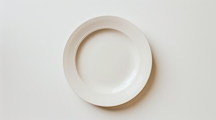 Top view of empty plate on white background 