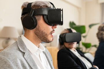 Young Professional Experiencing Advanced Virtual Reality Tech