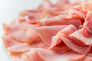 A Close-up Look at a Delicious Sliced Ham on a White Background 