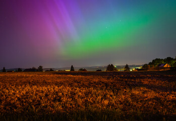 northern lights over the field in the night in germany