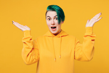 Young happy shocked surprised overjoyed woman with dyed green hair wear hoody casual clothes...