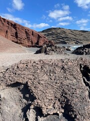 view of the bay and black rocks © Piotr