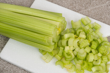 Fresh celery on cutting board ready for meal prep