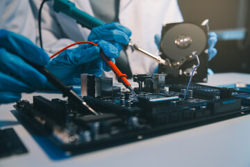 Obraz premium Close up of Technician measuring voltage electronic circuit board television, Service after sale fix electric equipment within insurance.