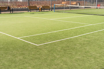 View of multi-functional sports area with tennis courts