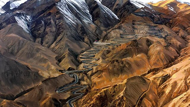 Aerial view of the winding road of the Panlong Ancient Road in Vacha township, Tashkurgan Pamir Plateau, Kashgar region, Xinjiang, China
