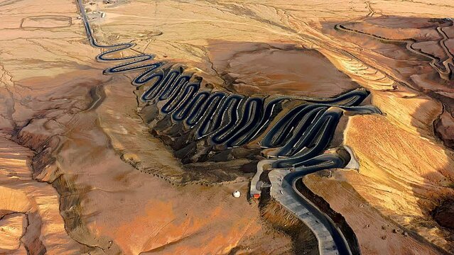 Aerial view of the winding road of the Panlong Ancient Road in Vacha township, Tashkurgan Pamir Plateau, Kashgar region, Xinjiang, China