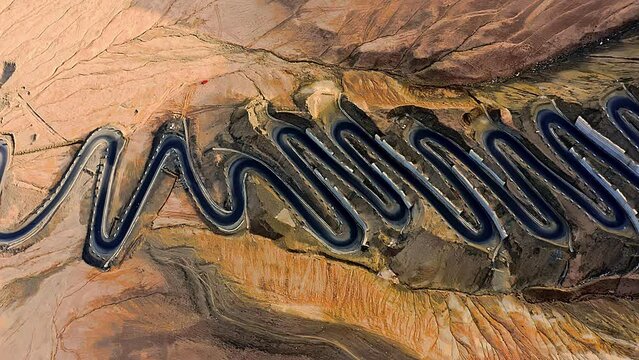 Aerial view of the winding road of the Panlong Ancient Road in Vacha township, Tashkurgan Pamir Plateau, Kashgar region, Xinjiang, China