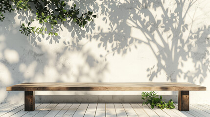 Empty natural wood table standing near white wall with plants leaves and shadows outdoors with copy space