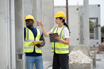 Portrait African American engineer man and Hispanic latin engineer woman checking precast cement at...