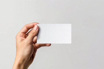 Fototapeta premium Business card mockup in woman hand. Blank calling card template on isolated background. Generative ai