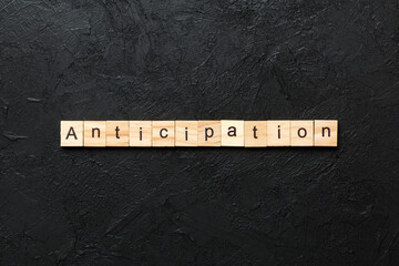 anticipation word written on wood block. anticipation text on cement table for your desing, concept