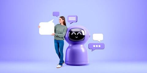 Woman showing mock up speech bubble, standing near smiling robot