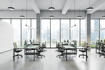 Modern office interior with pc monitors on tables, drawer and panoramic window