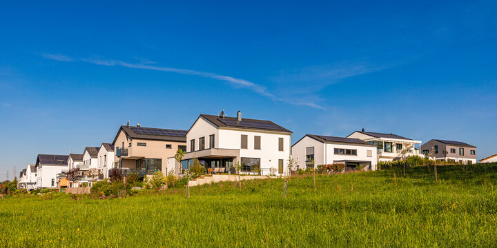 Germany, Baden-Wurttemberg, Waiblingen, Summer meadow in front of new development area