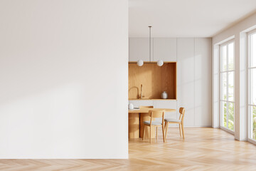 Wooden home kitchen interior with dinner table, cabinet and window. Mockup wall