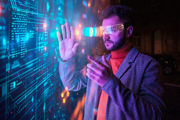 Engineer gesturing with smart glasses and examining big data