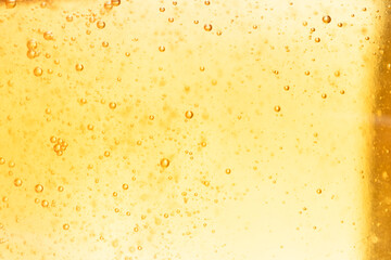 The surface of the cosmetic product has bubbles. blurred background. soft focus