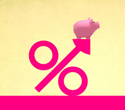Piggy bank on oversized percentage symbol against yellow background