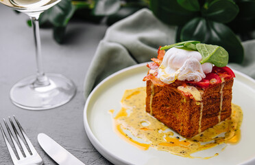 Gourmet breakfast toast with poached egg and sauce