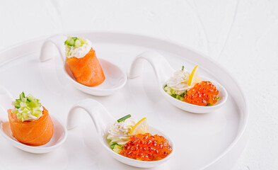 Elegant appetizers on white platter