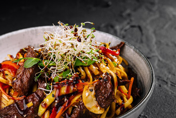 Asian beef noodle stir-fry in white bowl