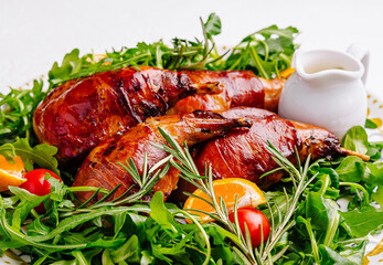 Gourmet roast quail on arugula salad