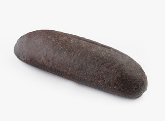 Whole black rye bread loaf on white background