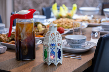 Ramadan lantern and dates on dinner table for taking and eating on iftar for family