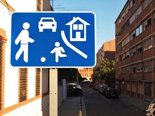 Blue warning living street traffic sign in a residential zone	