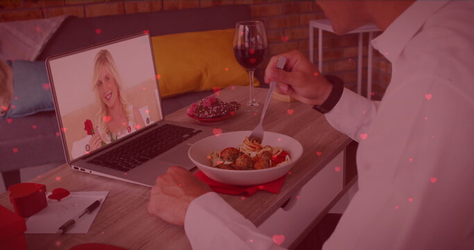 Caucasian couple enjoying virtual dinner date, boyfriend holding wine glass
