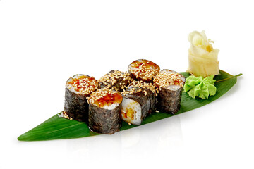 Eel maki sushi with unagi sauce and sesame on bamboo leaf