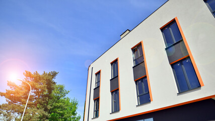 Sustainable glass office building with trees for reducing carbon dioxide. Eco-friendly building in modern city. Office with green environment. Corporate building reduce CO2.