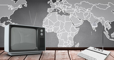 Image of vintage tv over world map