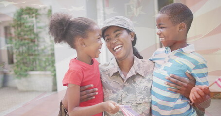 Image of flag of usa over african american female soldier with her children