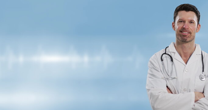 Image of caucasian male doctor over light spots